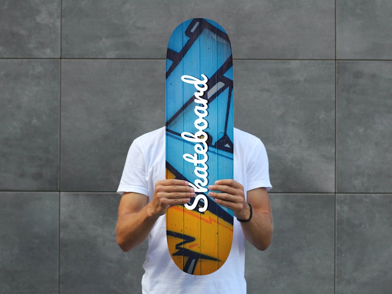 Man Holding Skateboard PSD Mockup preview