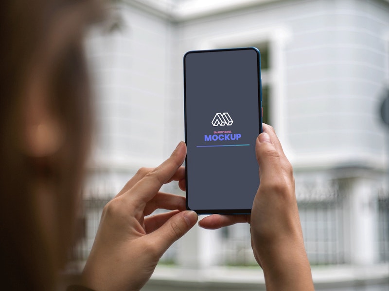 Woman Holding Smartphone Mockup preview